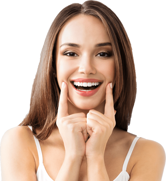 A woman is smiling with a hand close to her face